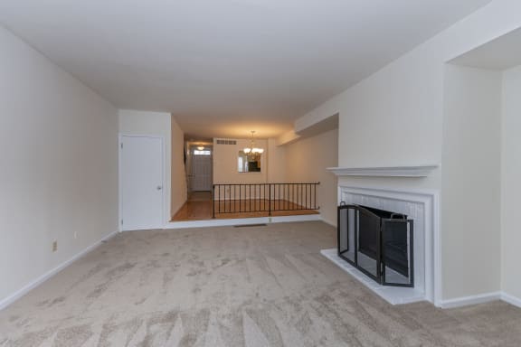 a living room with a fireplace and a carpeted floor at Indian Creek Apartments*, Cincinnati, 45236