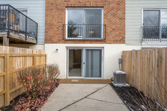 the front door of a brick house with a wooden fence at Indian Creek Apartments*, Cincinnati, OH, 45236