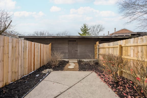 a house with a wooden fence and a sidewalk in front of it at Indian Creek Apartments*, Ohio, 45236