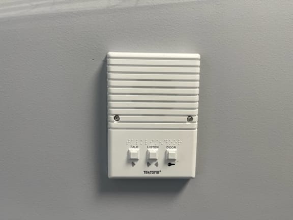 Light switch on a gray wall at Tall Timber Apartments, Cincinnati