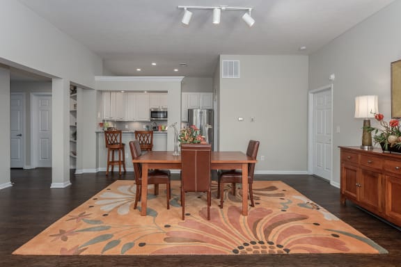 Open living room and dining room with a table and chairs