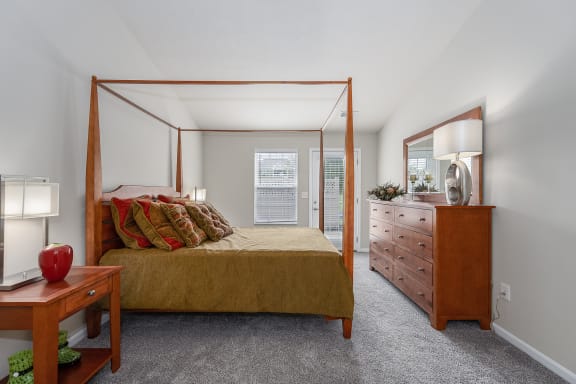 Bedroom with a bed and a dresser