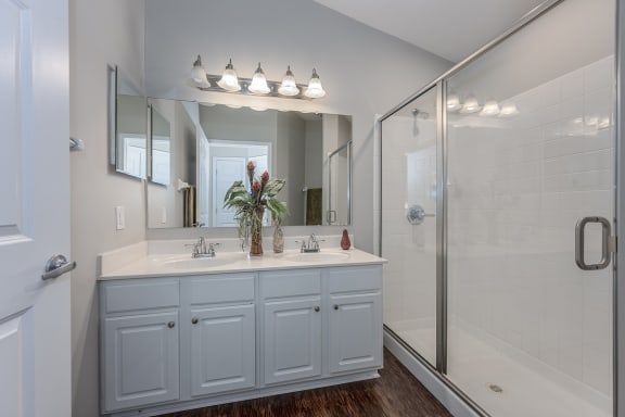 White bathroom with a shower and a sink