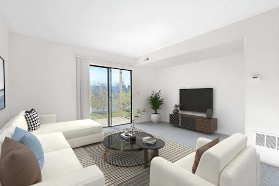 A modern living room with a white sofa, a glass coffee table, and a flat-screen TV.