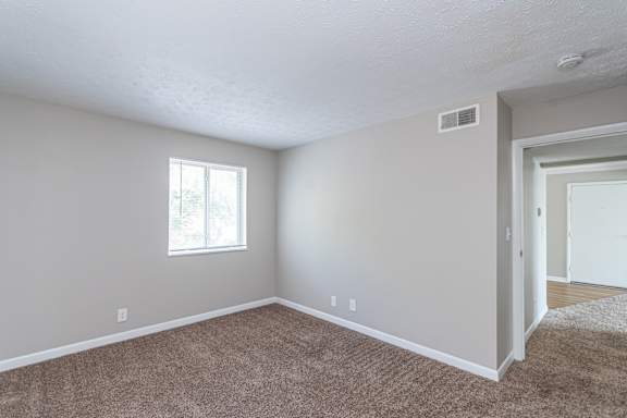 Bedroom with a window at Trails at Mariemont, Cincinnati, Ohio