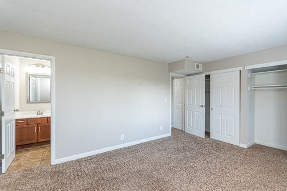 Bedroom with attached bath at Trails at Mariemont, Ohio