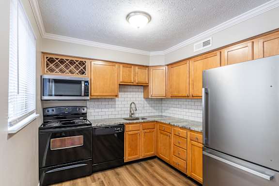 Kitchen with wooden cabinetry at Trails at Mariemont, Cincinnati, Ohio