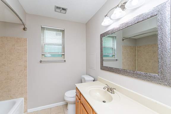 Bright bathroom with a mirror at Trails at Mariemont, Ohio
