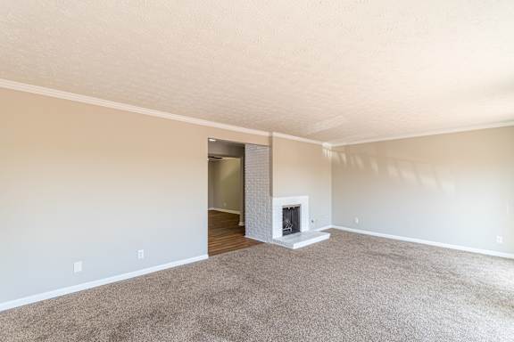 Spacious carpeted living room with fireplace at Trails at Mariemont, Ohio, 45227