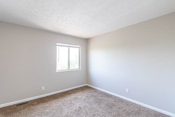 Spacious room with a window in the corner at Trails at Mariemont, Cincinnati, OH, 45227