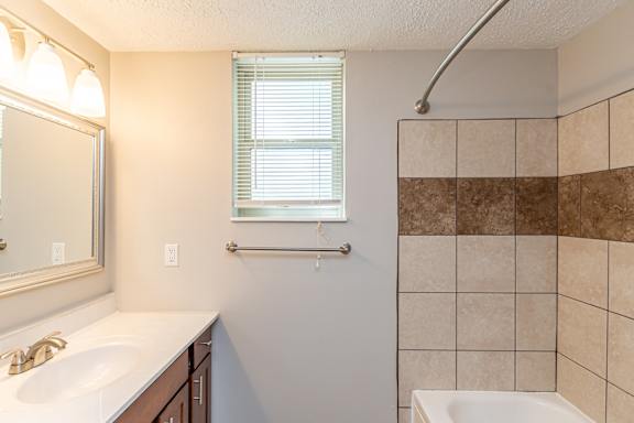 Bathroom with mirror and sink at Trails at Mariemont, Cincinnati, Ohio
