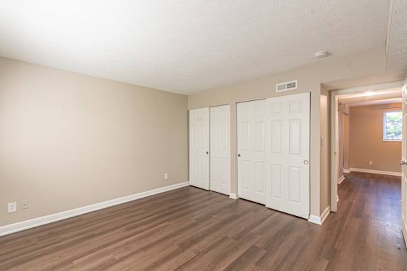 Bedroom with wooden floors at Trails at Mariemont, Ohio