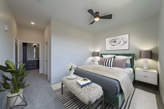 a bedroom with a bed and a ceiling fan at Adams Edge Apartments, Cincinnati, Ohio