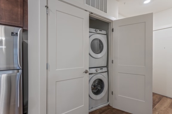 a small laundry room with a washer and dryer in a closet