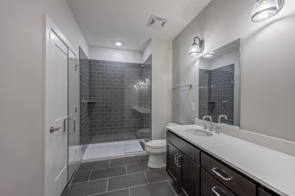 the preserve at ballantyne commons bathroom with sink toilet and shower