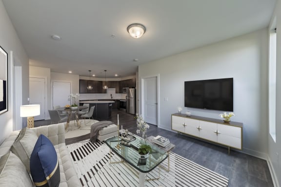 a living room with a white couch and a glass table at Adams Edge Apartments, Cincinnati