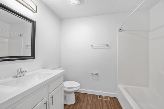 a bathroom with a sink toilet and a shower