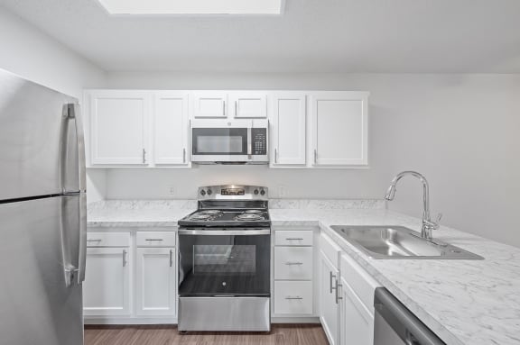 the preserve at ballantyne commons apartment kitchen with stainless steel appliances