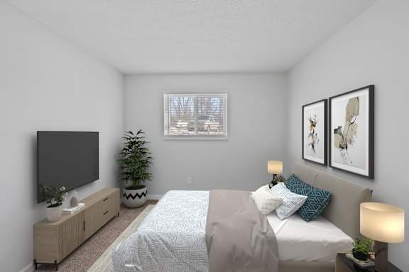 A bedroom with a bed, a television, and a potted plant. at The Apex, Ohio, 45239