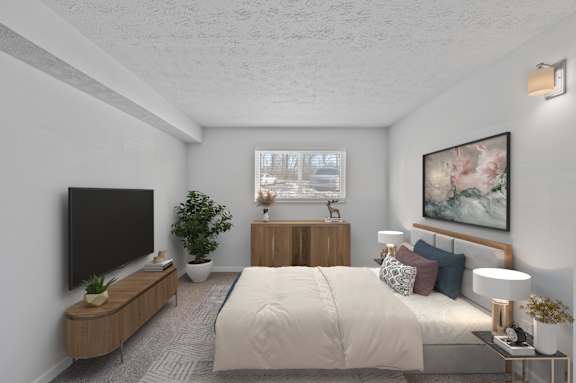 A modern bedroom with a large bed, a flat-screen TV, and a potted plant. at The Apex, Cincinnati, 45239