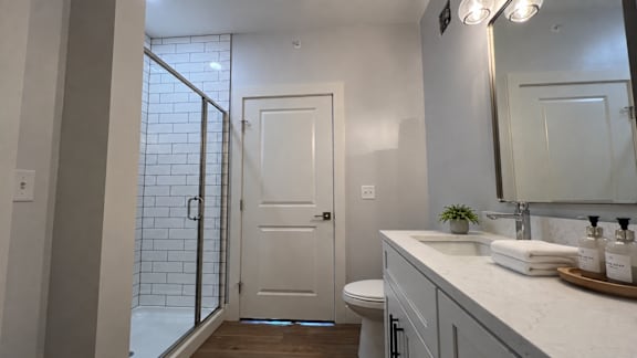 A bathroom with a white toilet and sink.