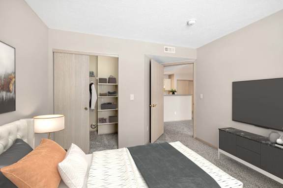 A bedroom with a bed, a lamp, a dresser, and a television.