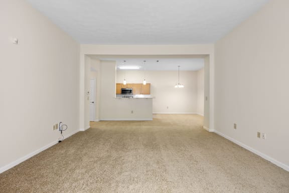 a spacious living room and kitchen with carpeting and white walls at Bishops Gate, Cincinnati, 45249