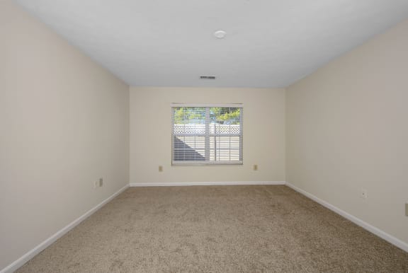 an empty living room with a window and carpet at Bishops Gate, Cincinnati, 45249