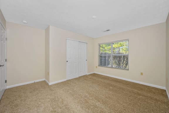 an empty living room with a window and a door at Bishops Gate, Ohio