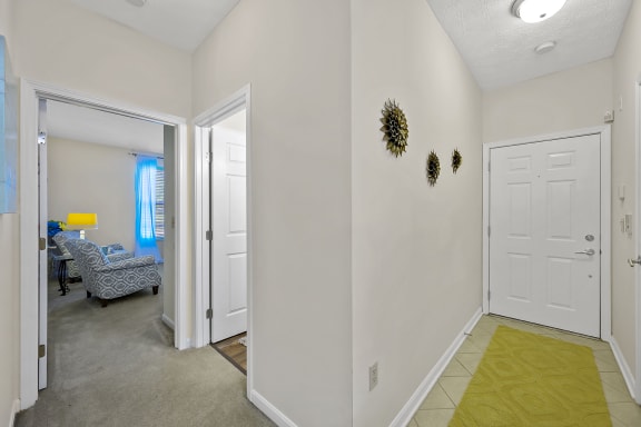 a living room with white walls and a door to a bedroom at Bishops Gate, Cincinnati, 45249