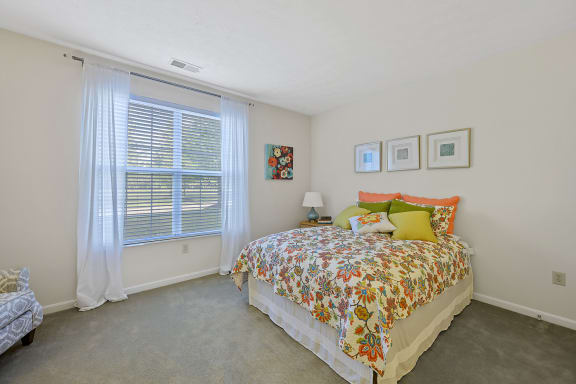 a bedroom with a bed and a large window at Bishops Gate, Ohio