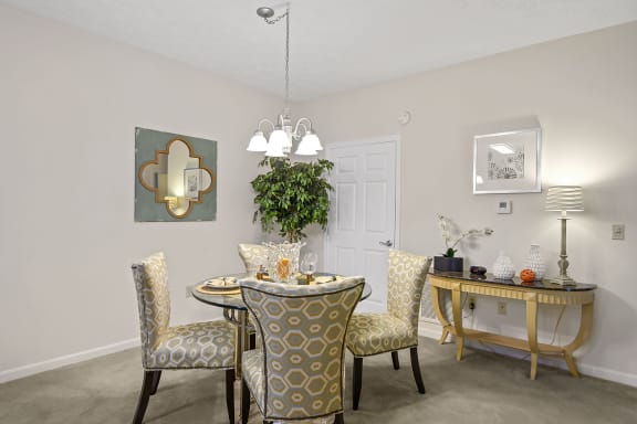 an open dining room with a table and chairs at Bishops Gate, Ohio