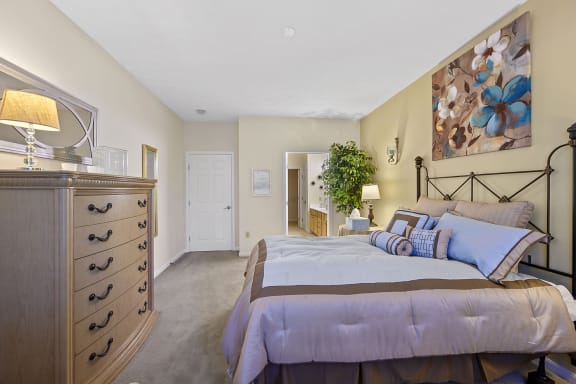 a bedroom with a bed and a dresser at Bishops Gate, Cincinnati, 45249
