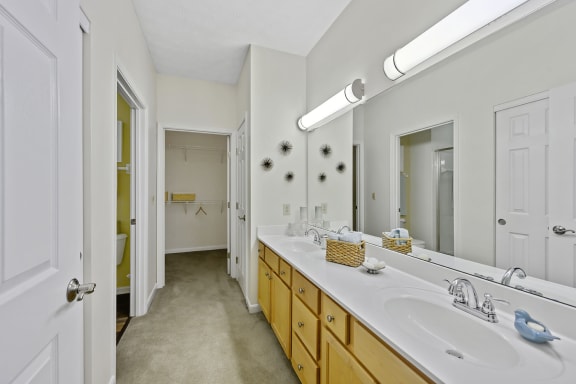 a bathroom with two sinks and a large mirror at Bishops Gate, Ohio, 45249