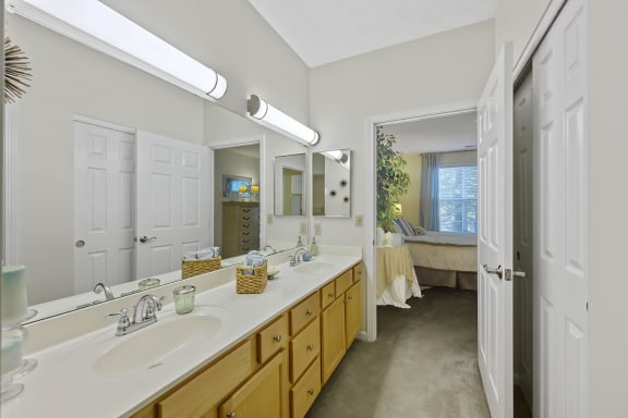 a bathroom with two sinks and a mirror at Bishops Gate, Ohio