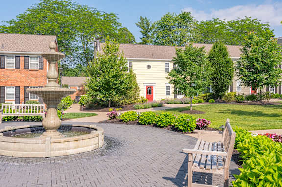 A park with a bench and a fountain in the middle. A park with a bench and a fountain in the middle. at Indian Creek Apartments*, Cincinnati, OH