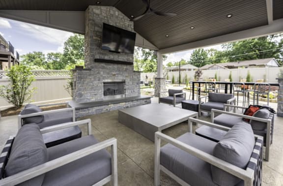 a patio with couches and a fireplace at Olde Towne in Kenwood, Ohio, 45243