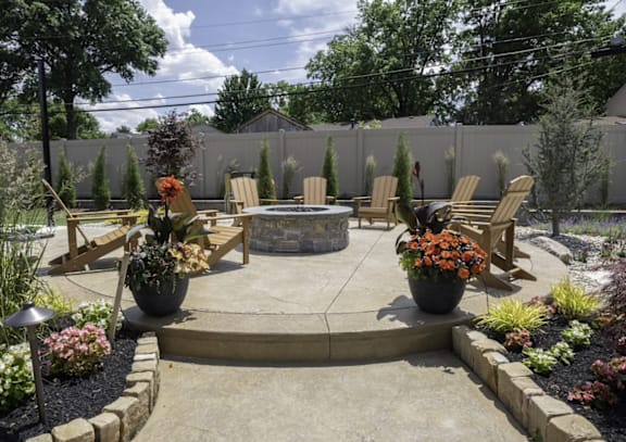 a stamped concrete patio with a fire pit and lounge chairs at Olde Towne in Kenwood, Cincinnati, OH, 45243