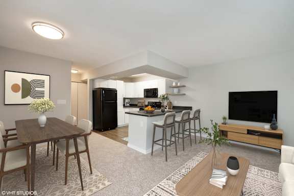 A modern living room with a dining table and chairs. at 7 Pointe Apartments, Indianapolis, IN, 46205
