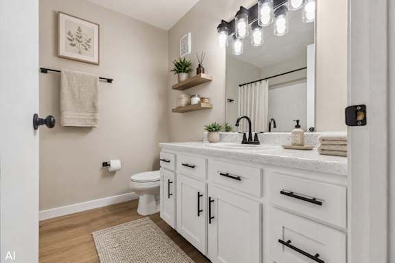 A white bathroom with a towel rack and a mirror.