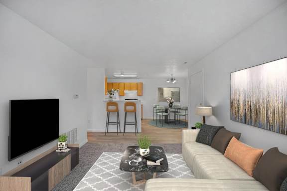 A living room with a white couch and a television on the left side.