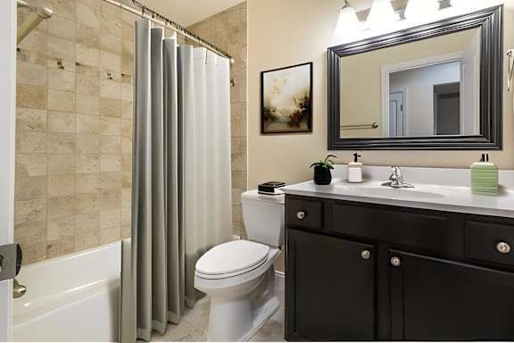 a bathroom with a shower and a toilet and a sink at Olde Towne in Kenwood, Cincinnati, 45243
