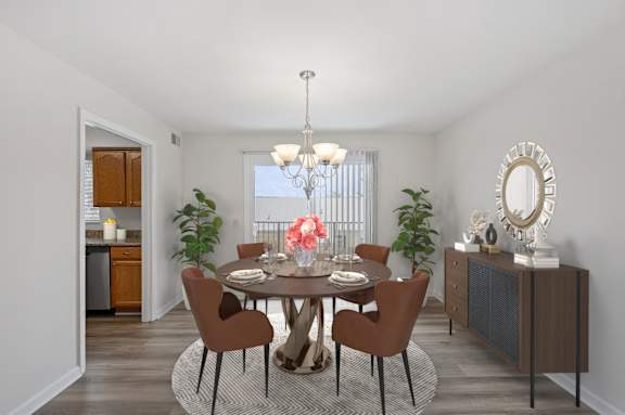 A dining room with a round table and chairs. at Indian Creek Apartments*, Cincinnati, OH