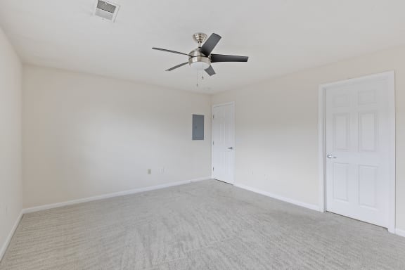 an empty living room with a ceiling fan at Four Bridges, Liberty Township, OH, 45044-8380