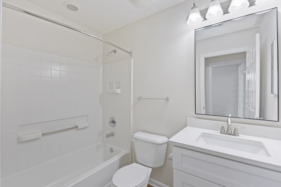 a bathroom with a sink toilet and a tub at Four Bridges, Liberty Township, Ohio