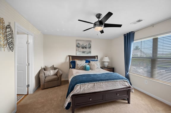 Bedroom with a bed and a ceiling fan at Four Bridges, Liberty Township, 45044-8380