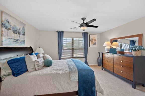 Bedroom with a large bed and a ceiling fan at Four Bridges, Liberty Township, OH, 45044-8380