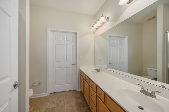 Ballantyne commons apartment bathroom with sink and mirror at Four Bridges, Liberty Township, OH, 45044-8380