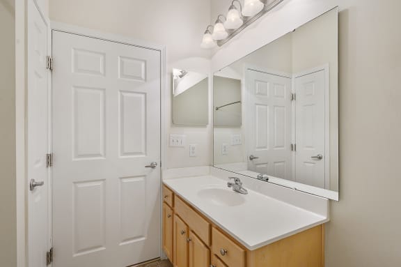 Bathroom with a sink and mirror and a closet at Four Bridges, Liberty Township, OH, 45044-8380