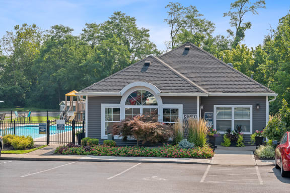 Property with a swimming pool in front of it at Galbraith Pointe Apartments and Townhomes, Cincinnati, OH, 45231